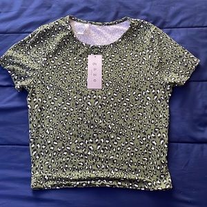 Brand new fitted green top.